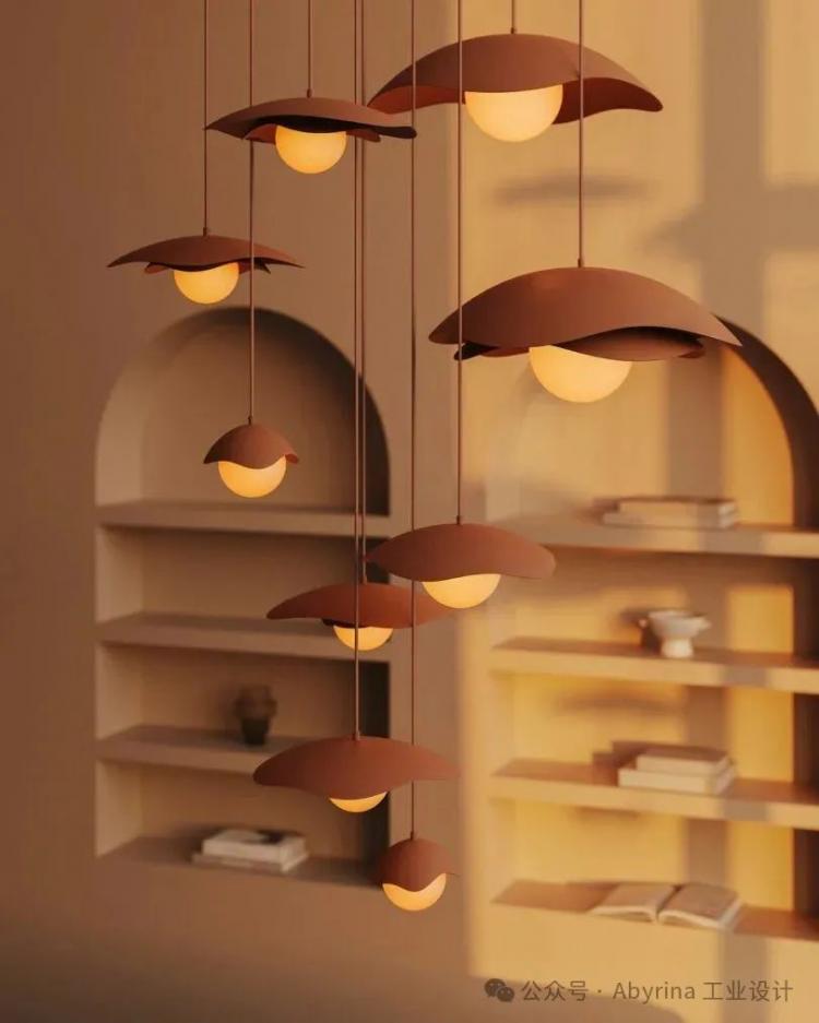 Cluster of modern pendant lights with dome-shaped shades hang in front of beige wall with built-in shelves holding books and decorative objects, illuminated by warm light.