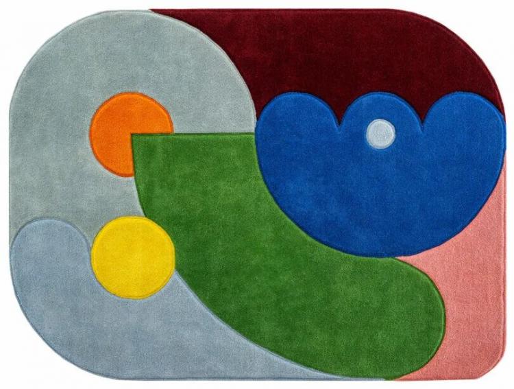 Rectangular rug with rounded corners featuring abstract shapes in green, blue, red, gray, yellow, and orange—arranged in a geometric, modern design inspired by Sam Buckley.